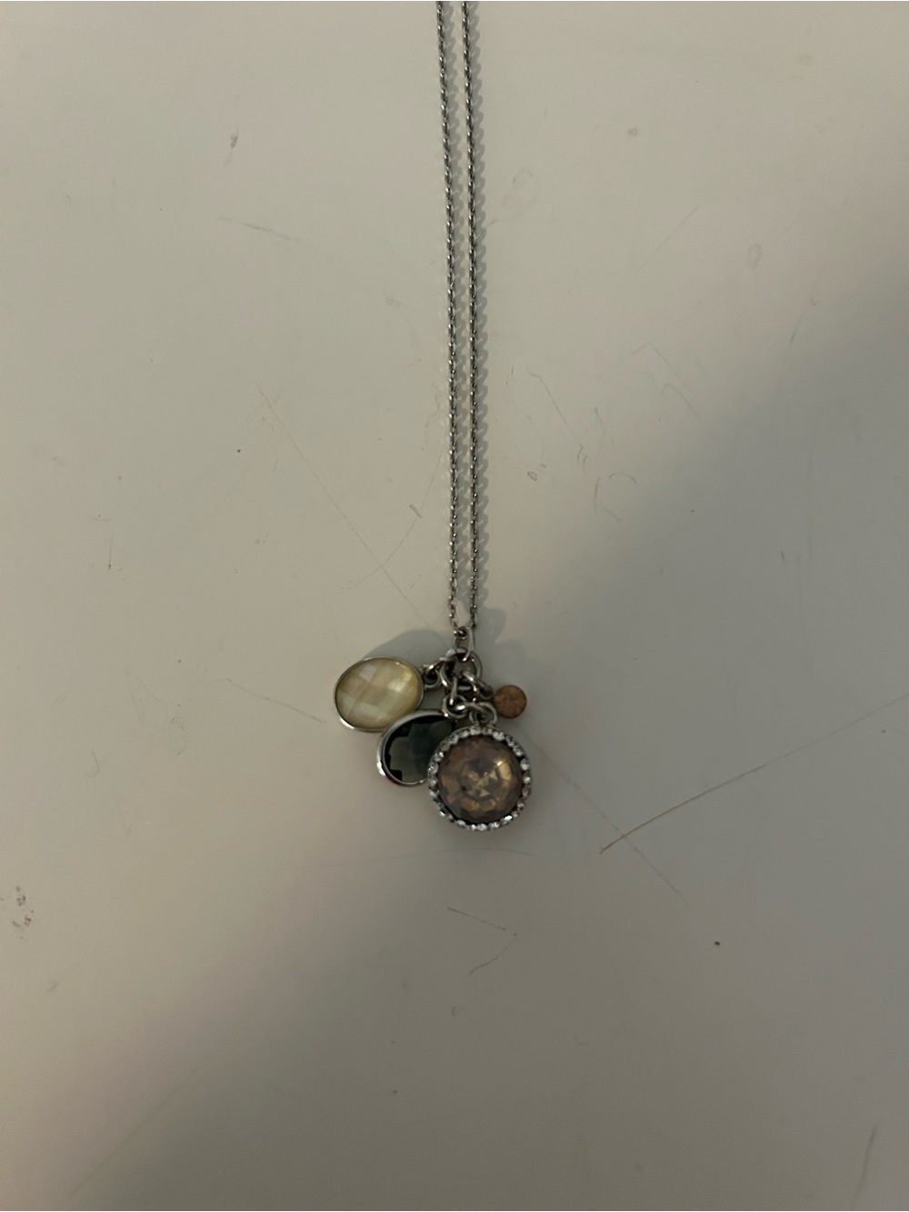 Silver Multi-Charm Pendant Necklace with Neutral Gemstone Accents